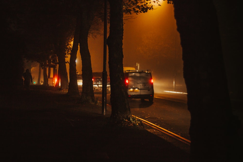 black car on road during sunset