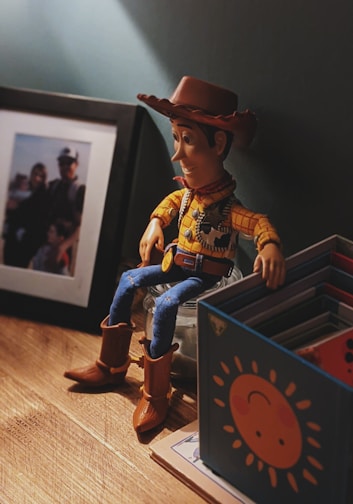 boy in cowboy costume standing on wooden box