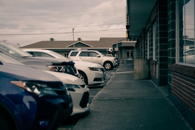 cars parked on side of the road during daytime