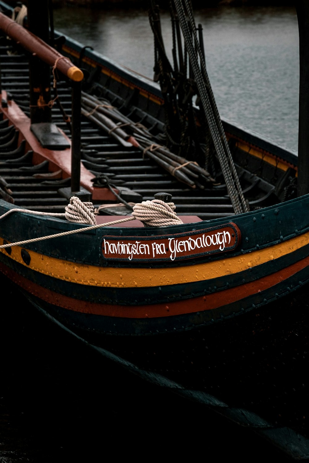 black and brown boat on sea during daytime