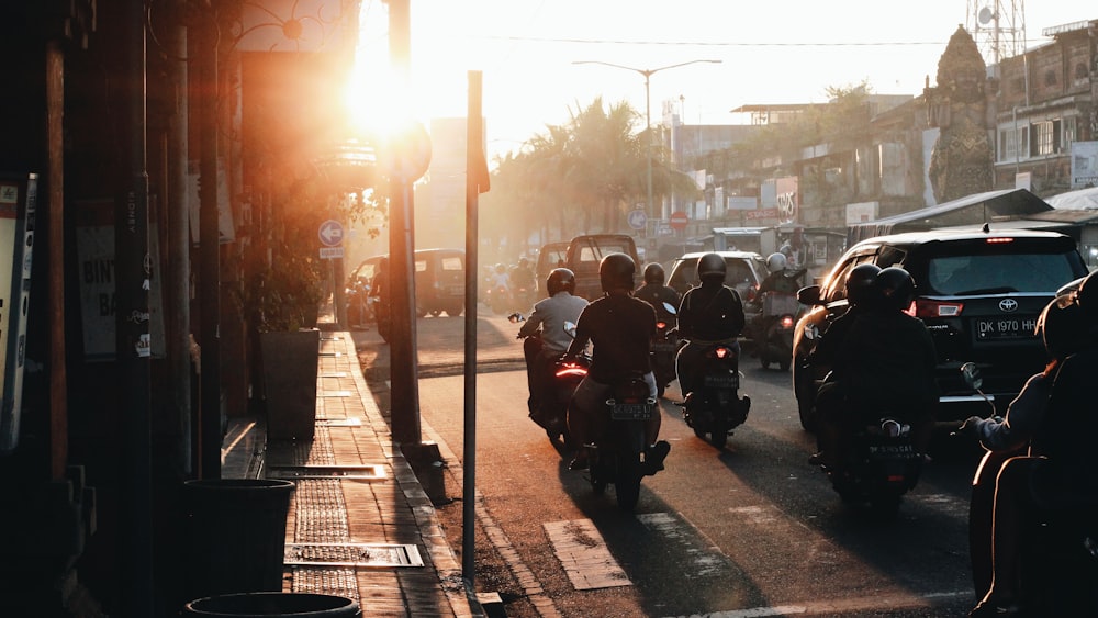 people riding motorcycle on road during daytime