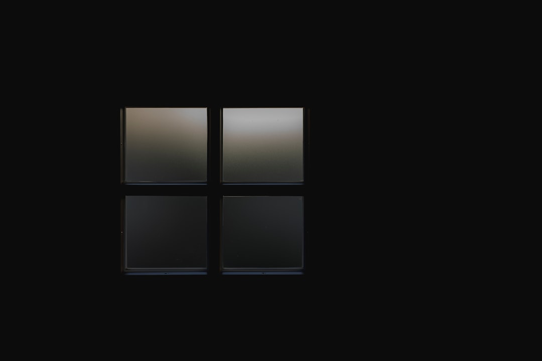 black wooden framed glass window