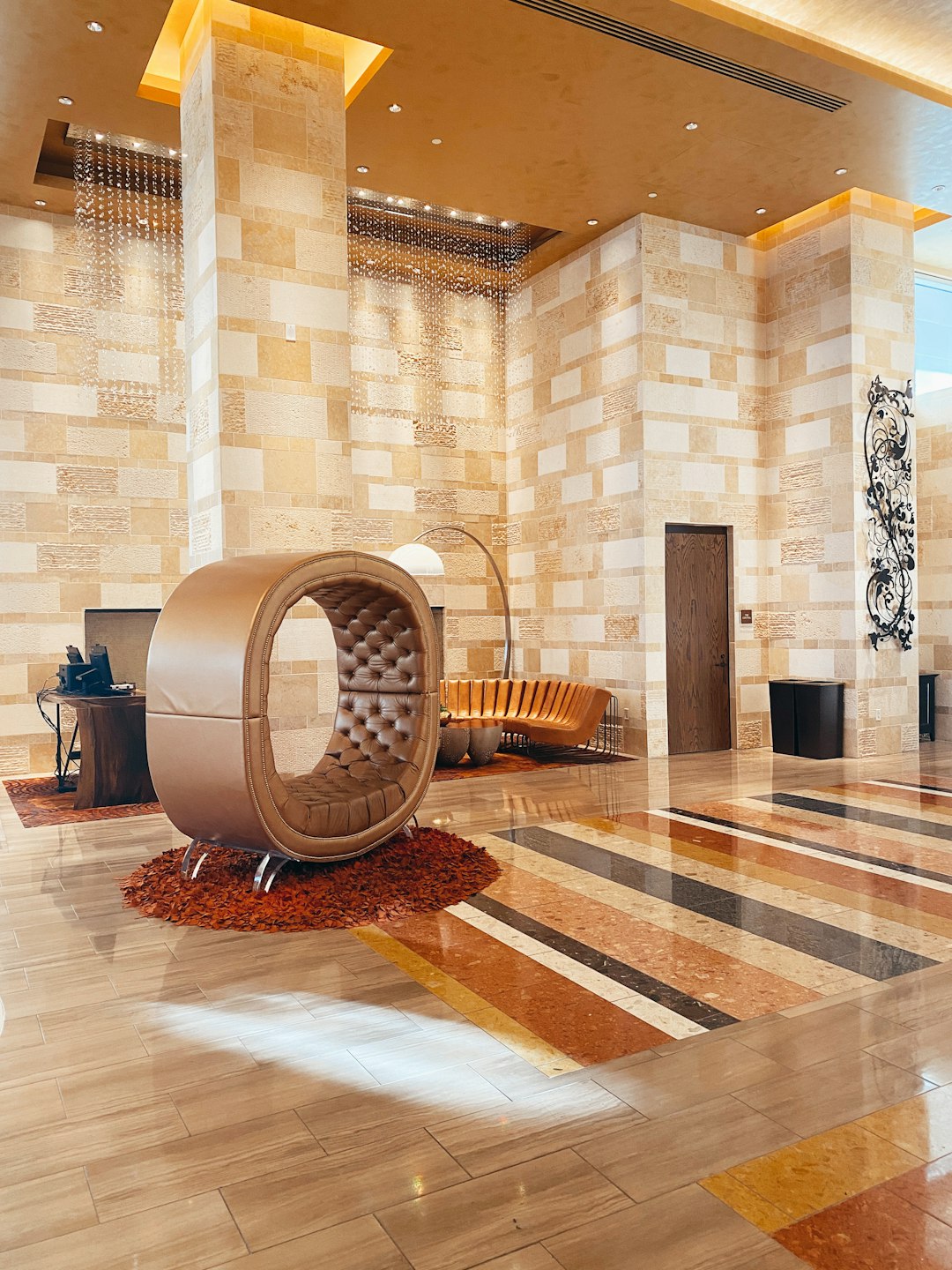 brown wooden round table near brown brick wall