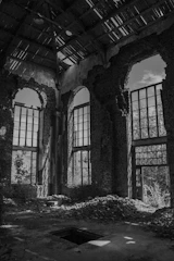 grayscale photo of brick building
