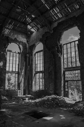 grayscale photo of brick building