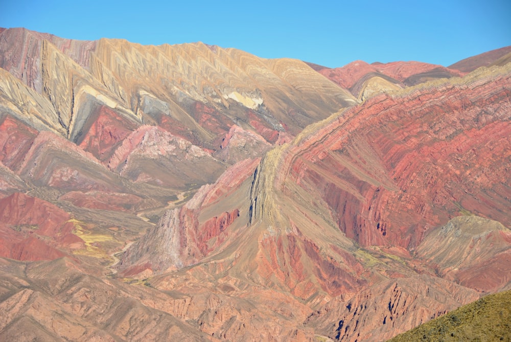 brown and green mountains under blue sky during daytime