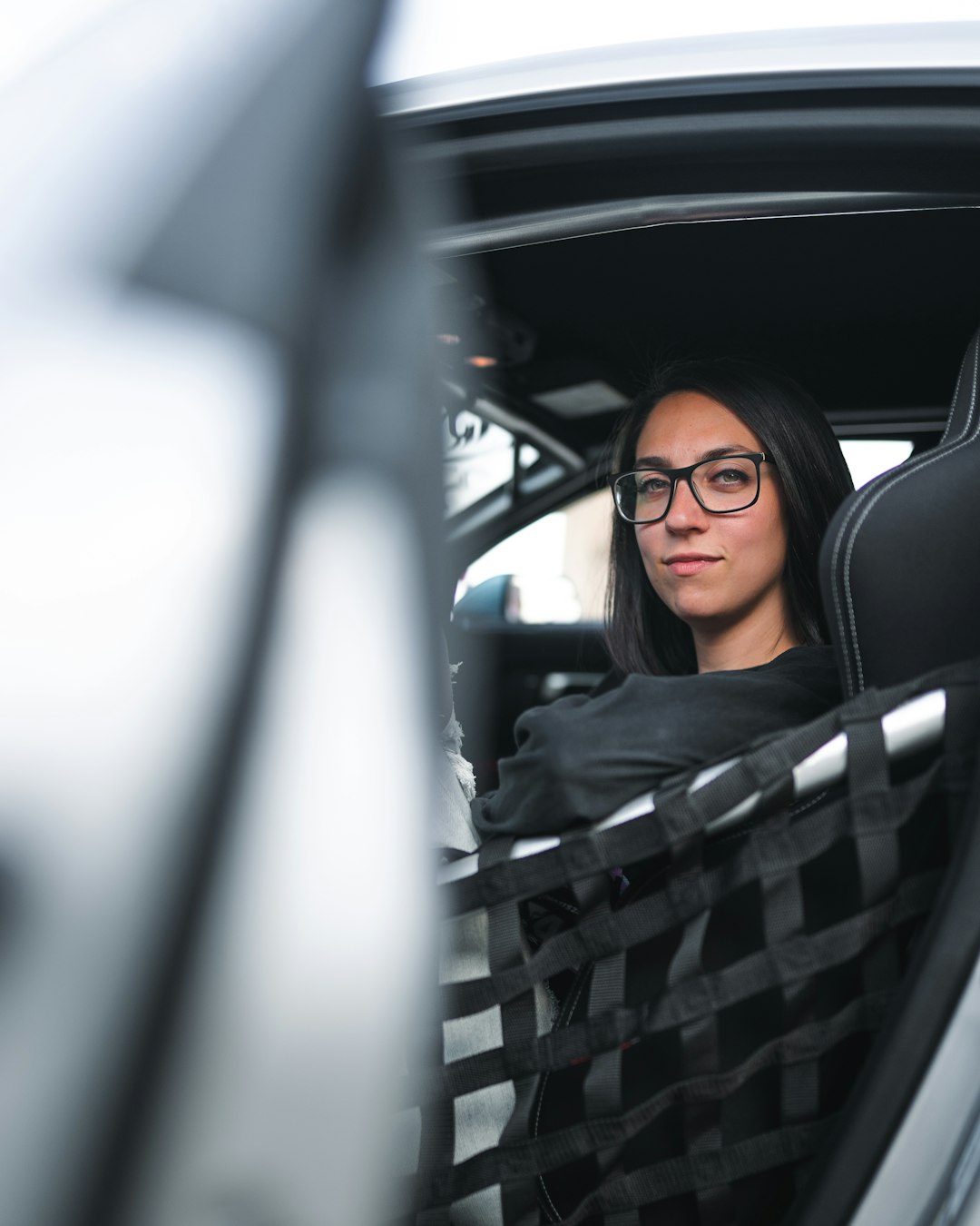 woman in black hijab inside car