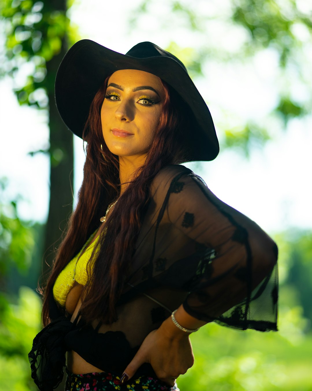 woman in black hat and brown jacket