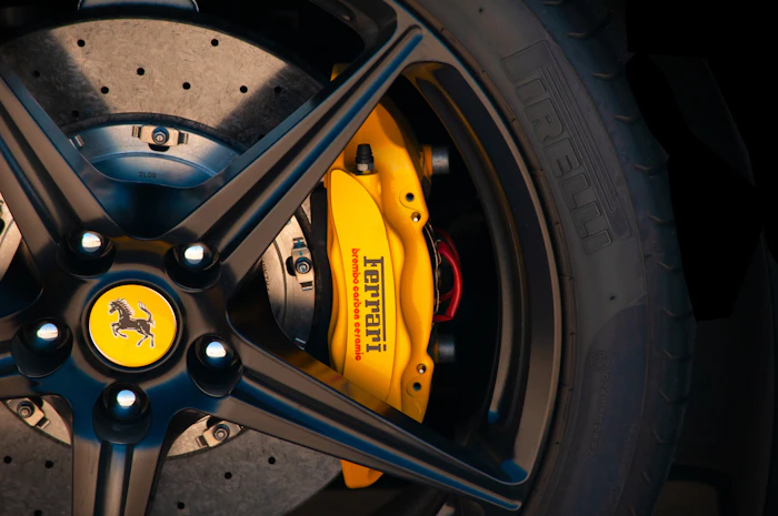 Yellow painted brake caliper on wheel