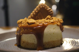 Decadent gula melaka cheesecake topped with caramelized palm sugar drizzle.