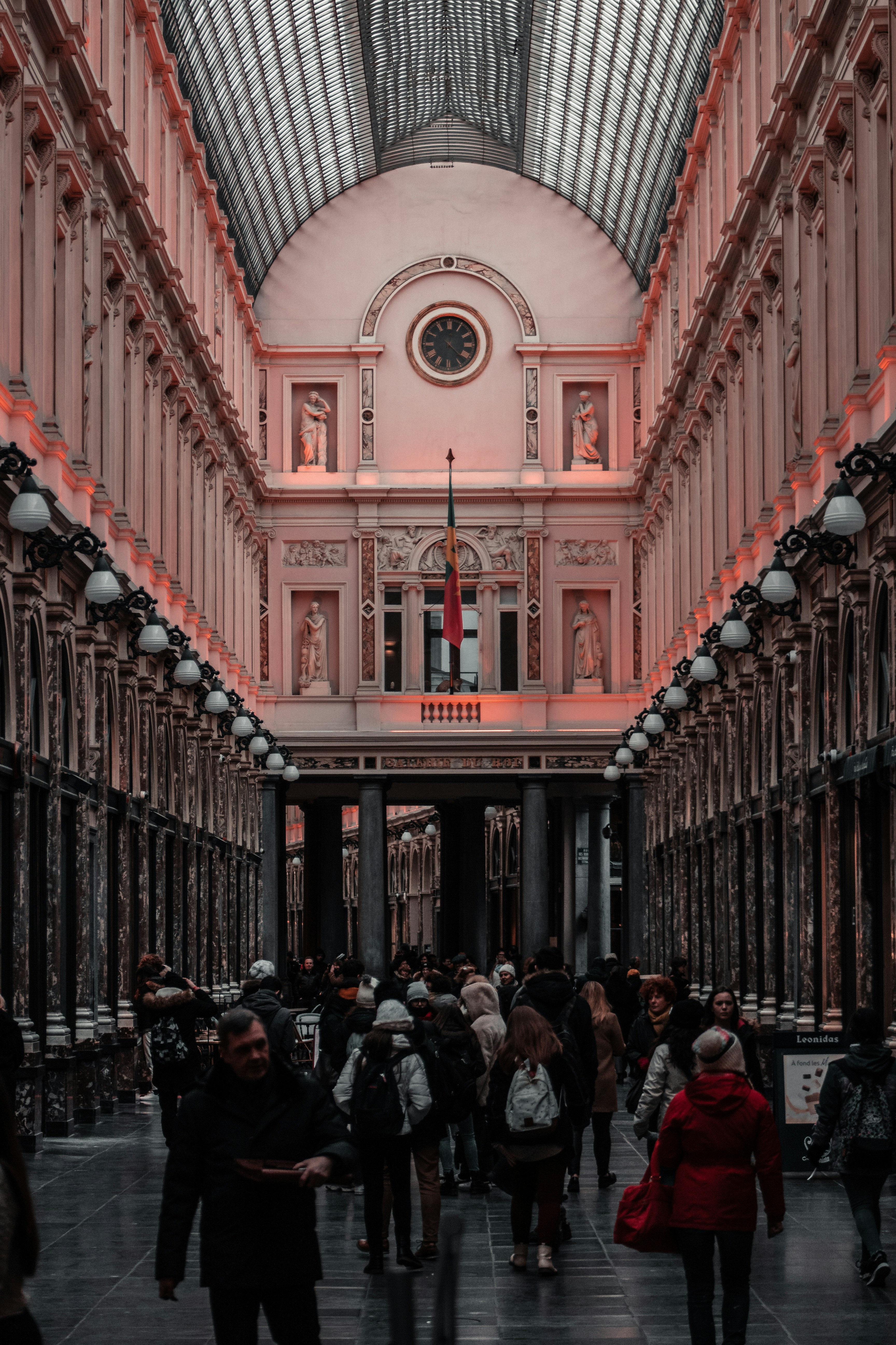 people walking on hallway inside building