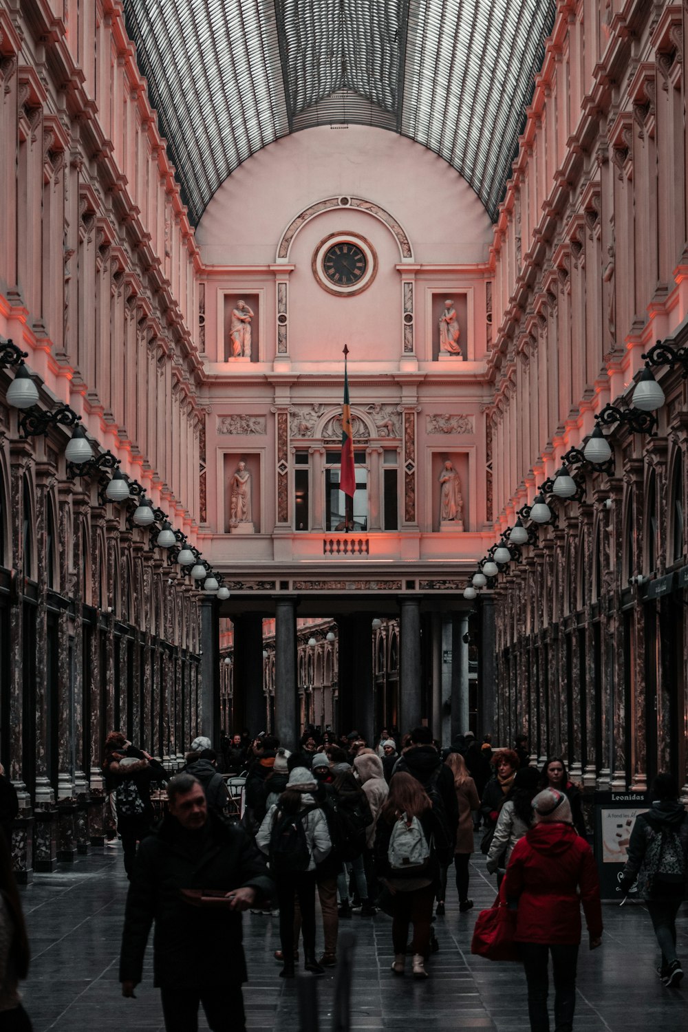 people walking on hallway inside building