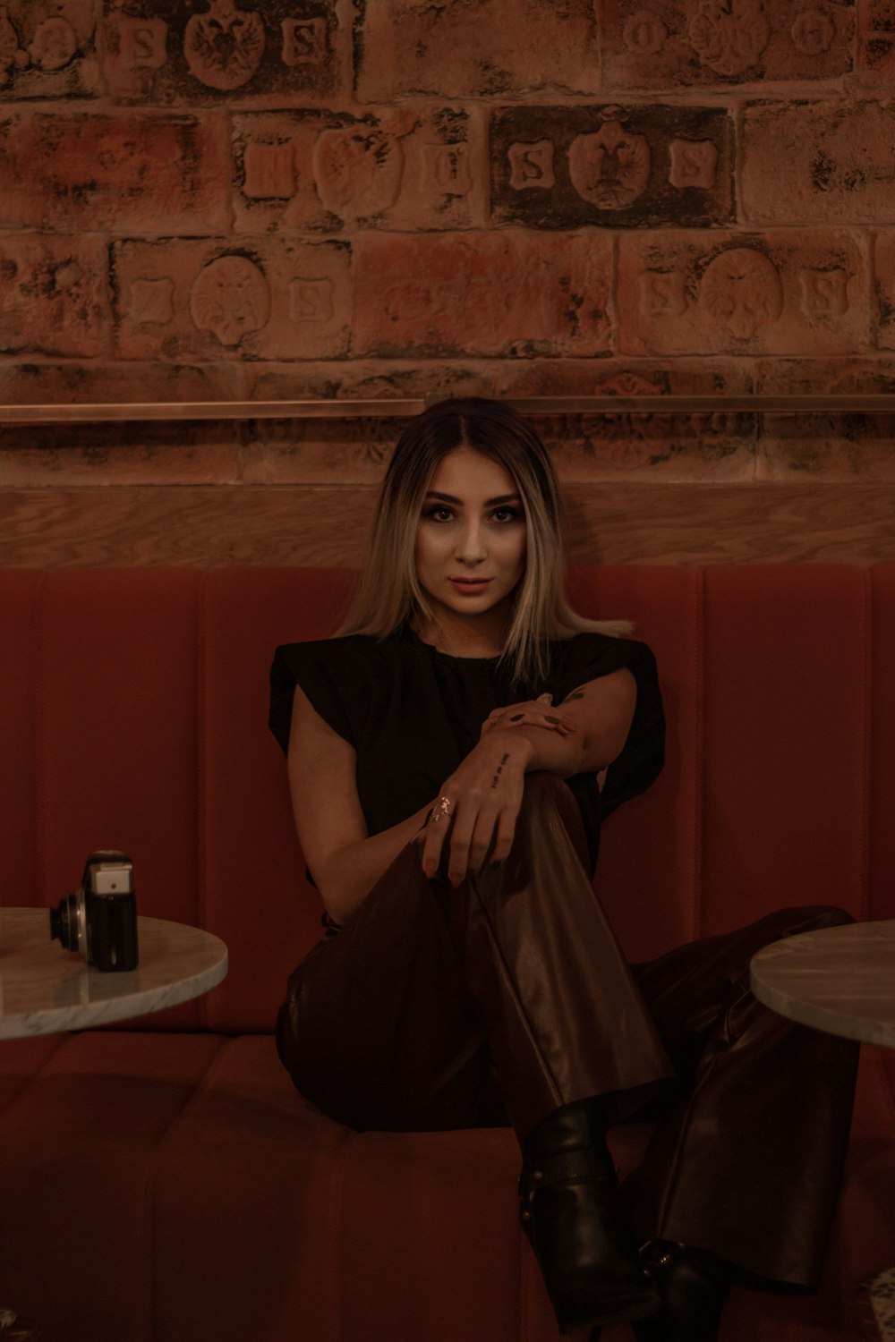 woman in black shirt sitting on chair