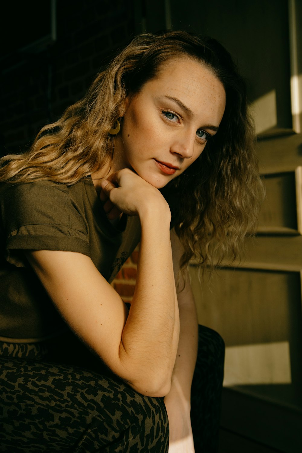 woman in black shirt sitting on chair