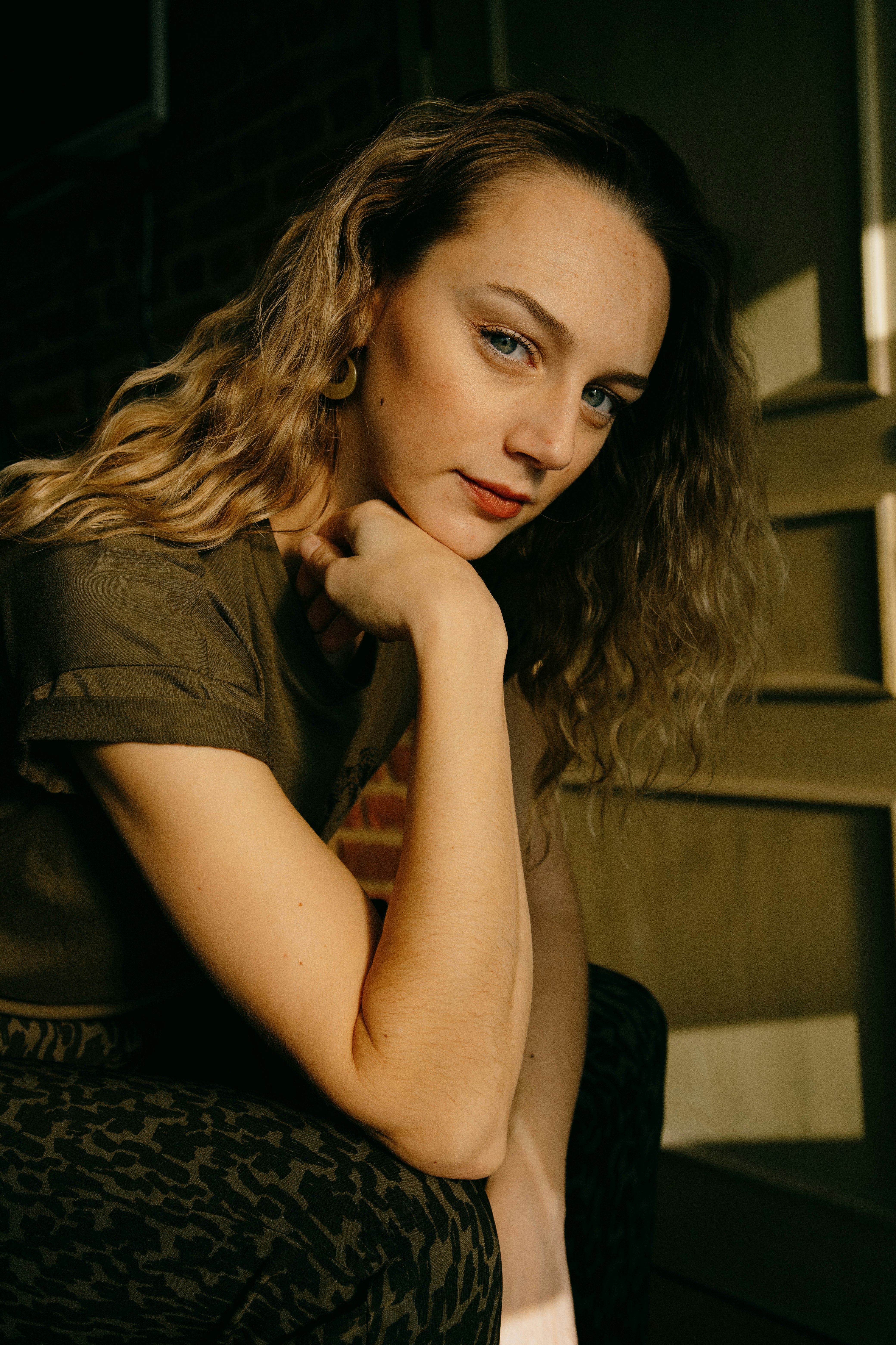 woman in black shirt sitting on chair