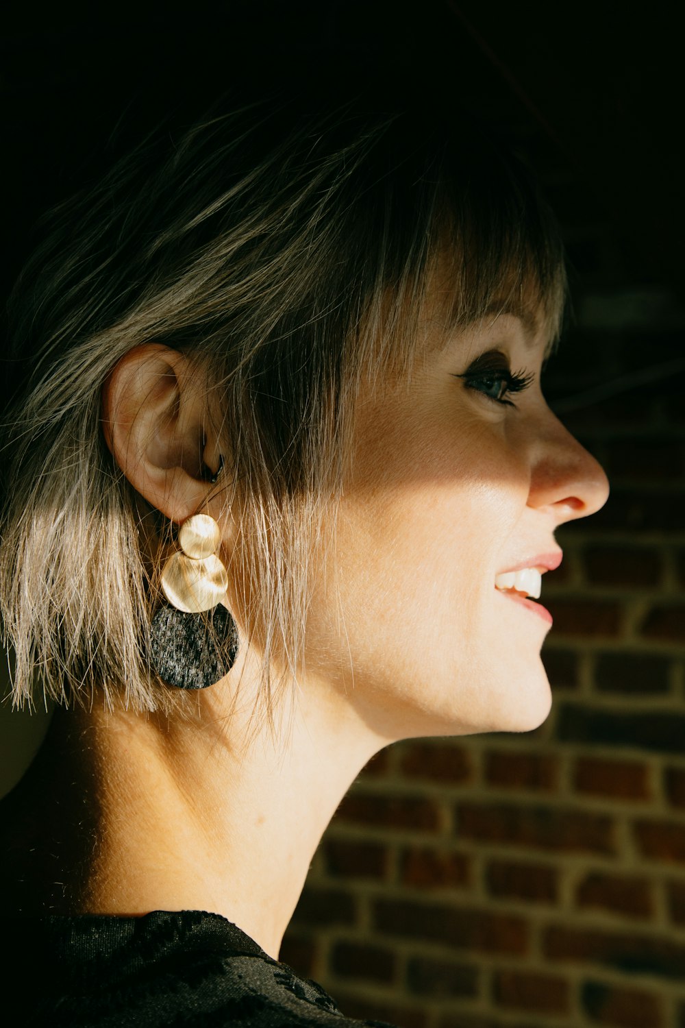 woman with white pearl stud earring