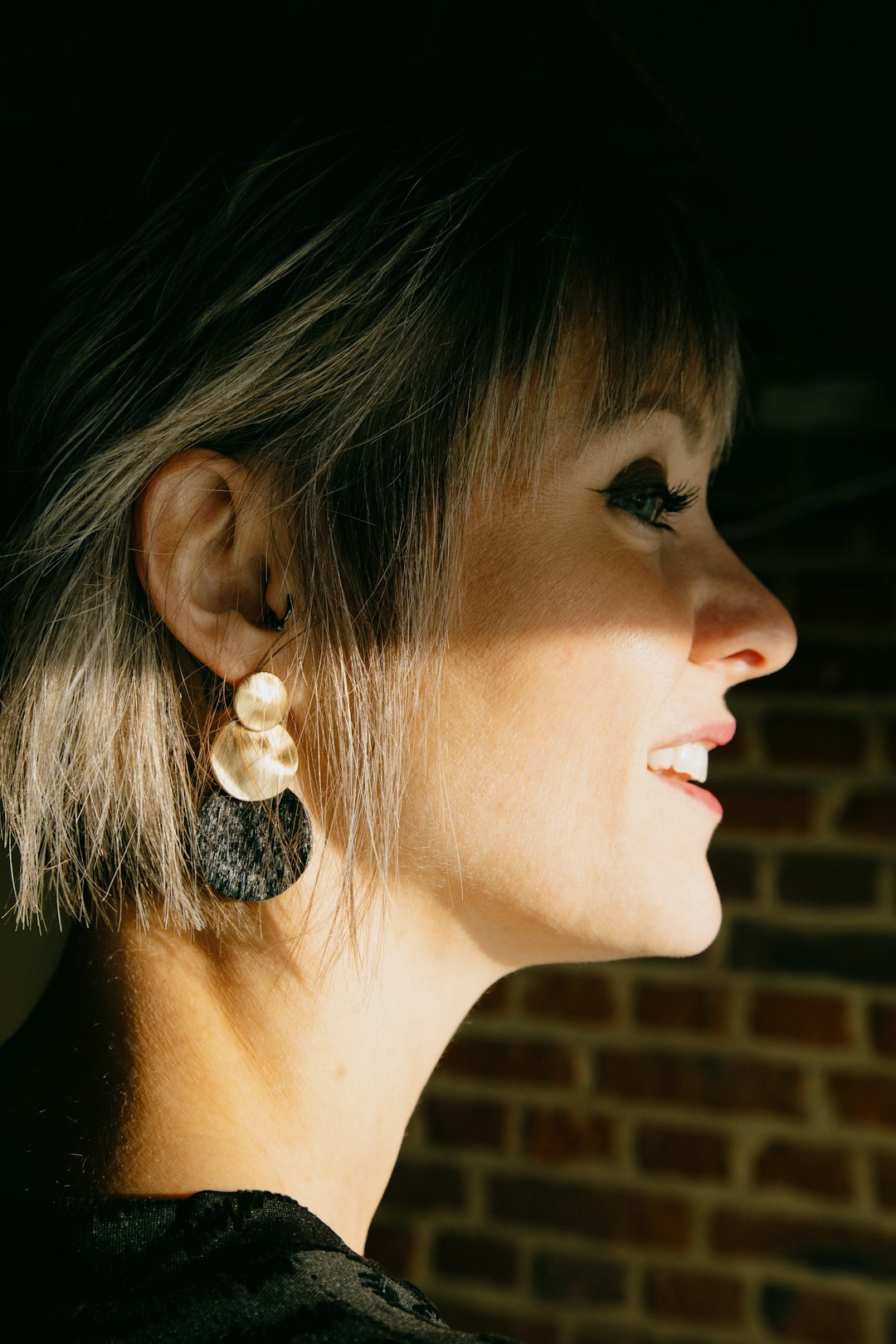woman with white pearl stud earring