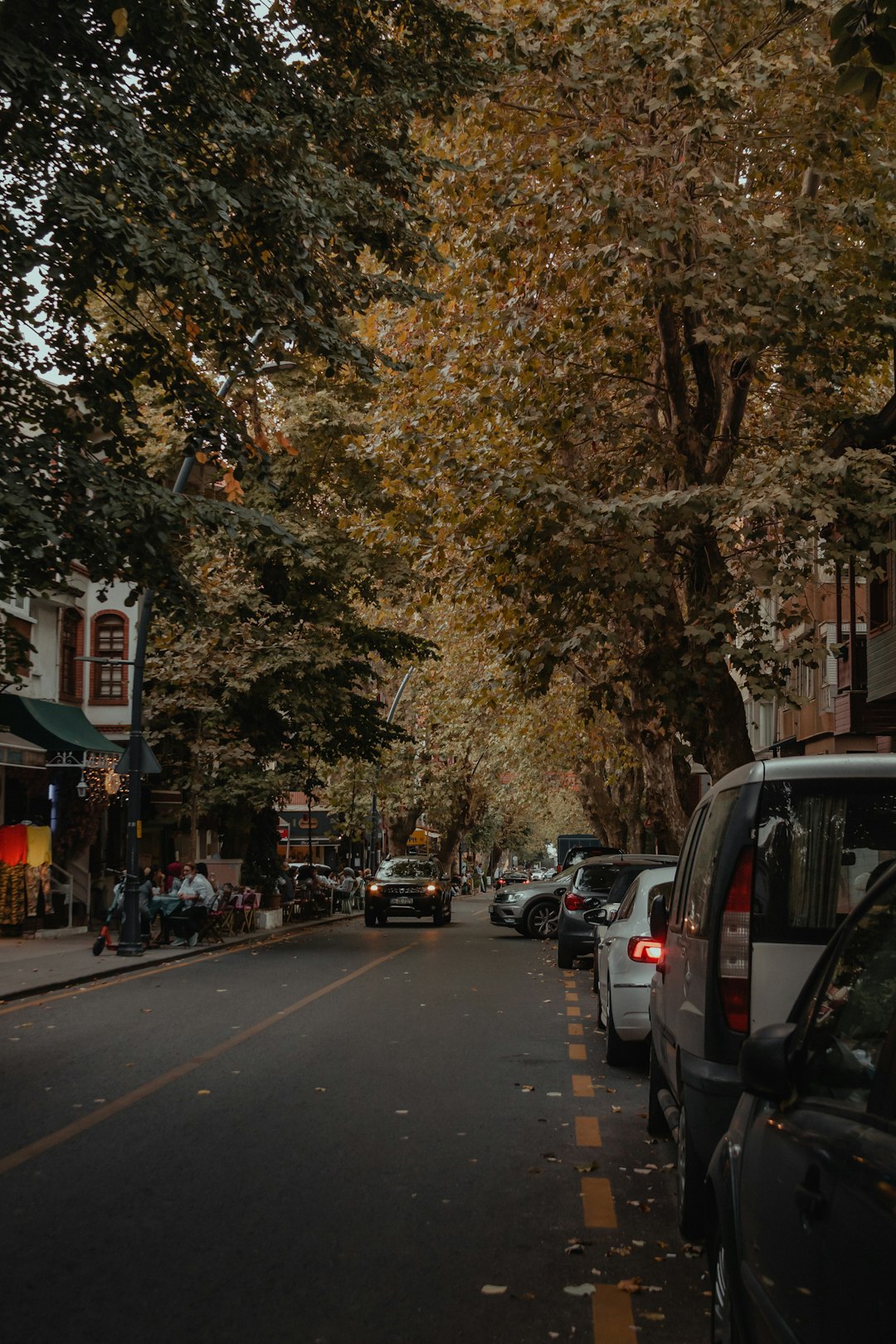 cars parked on sidewalk during daytime