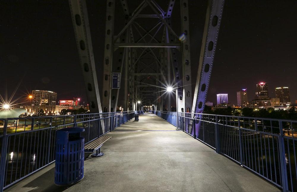 people walking on bridge during night time