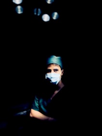 man in black crew neck t-shirt wearing white goggles