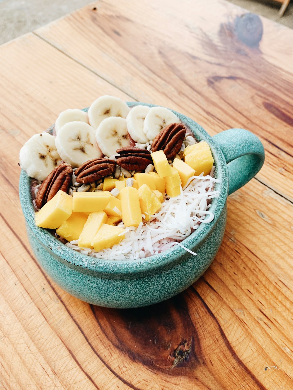 sliced cheese on green ceramic bowl