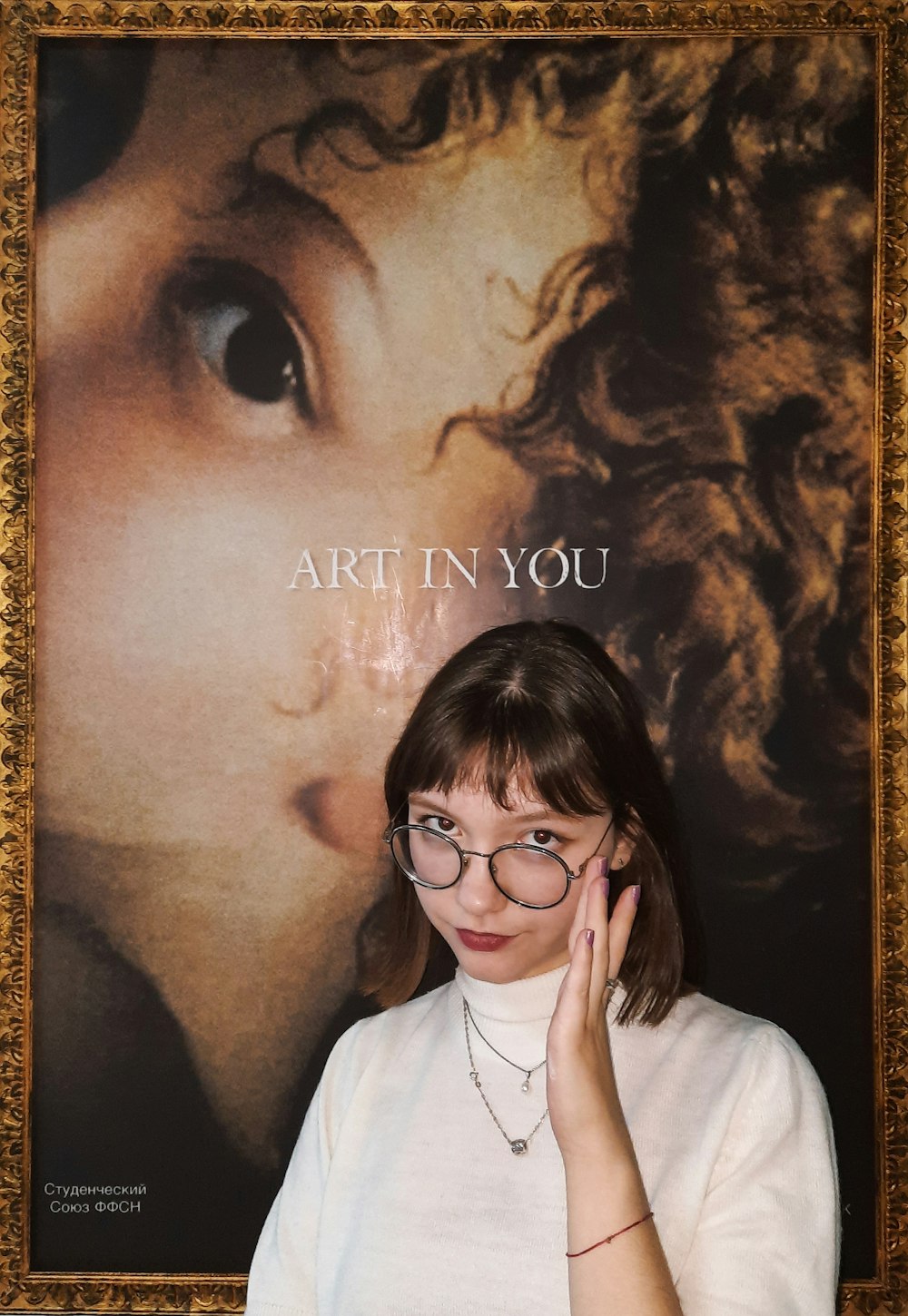 woman in white shirt wearing black framed eyeglasses