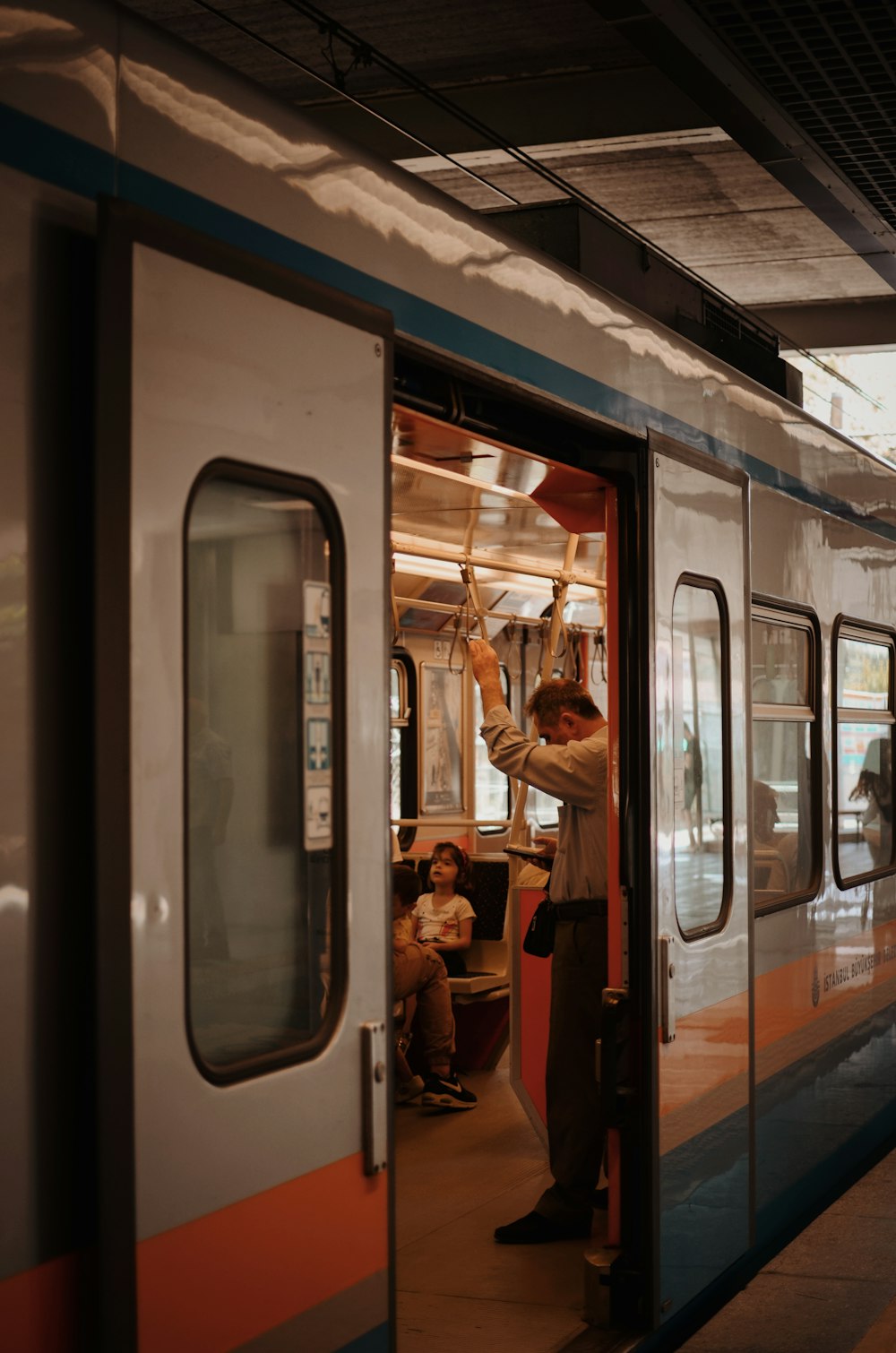 people in train during daytime