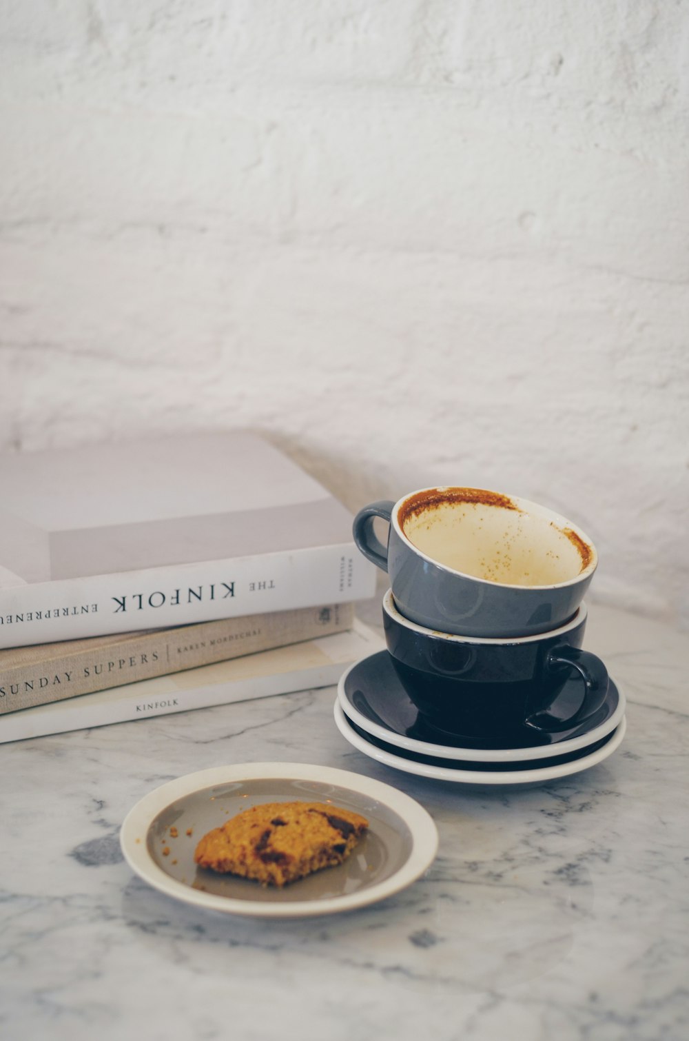 white ceramic cup on white ceramic saucer