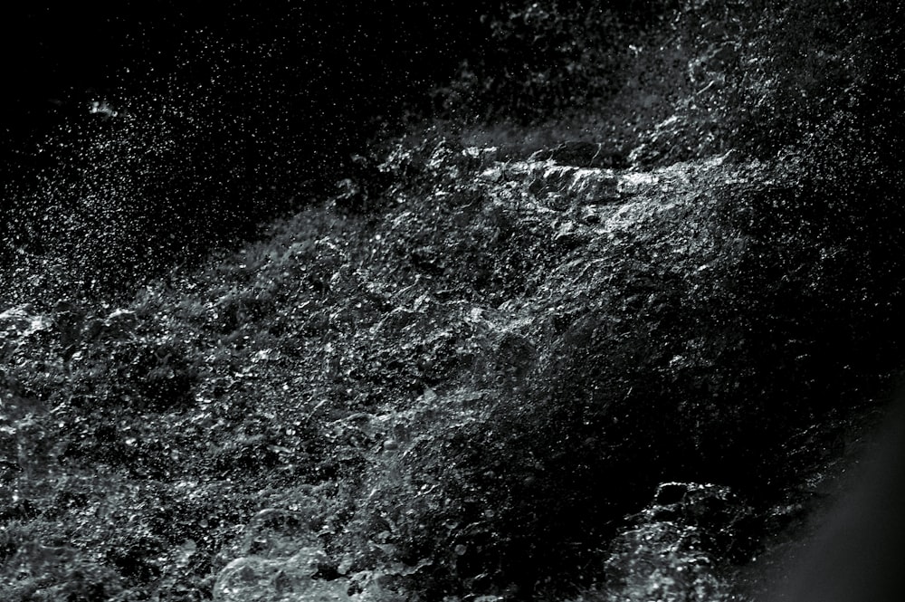 water waves on black and white surface