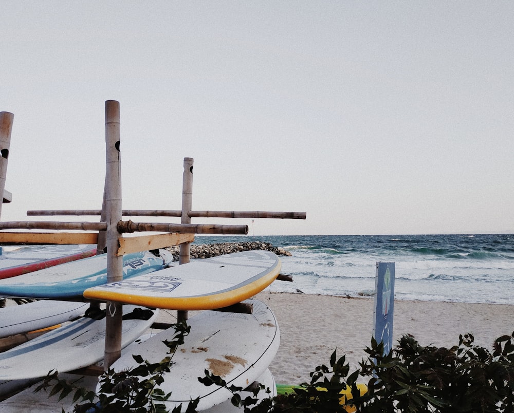 brown wooden boat on beach during daytime