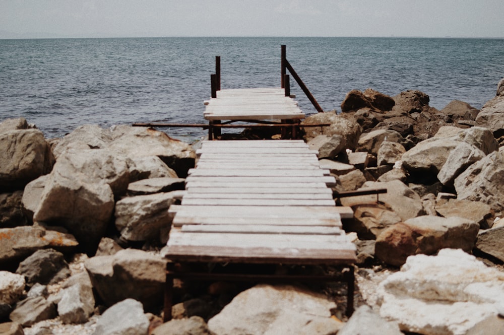 brown wooden dock on sea during daytime