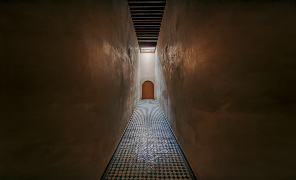 brown concrete tunnel with light