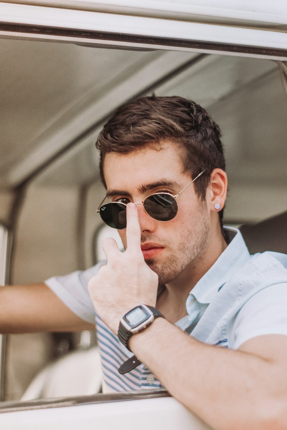 man in white button up shirt wearing black sunglasses