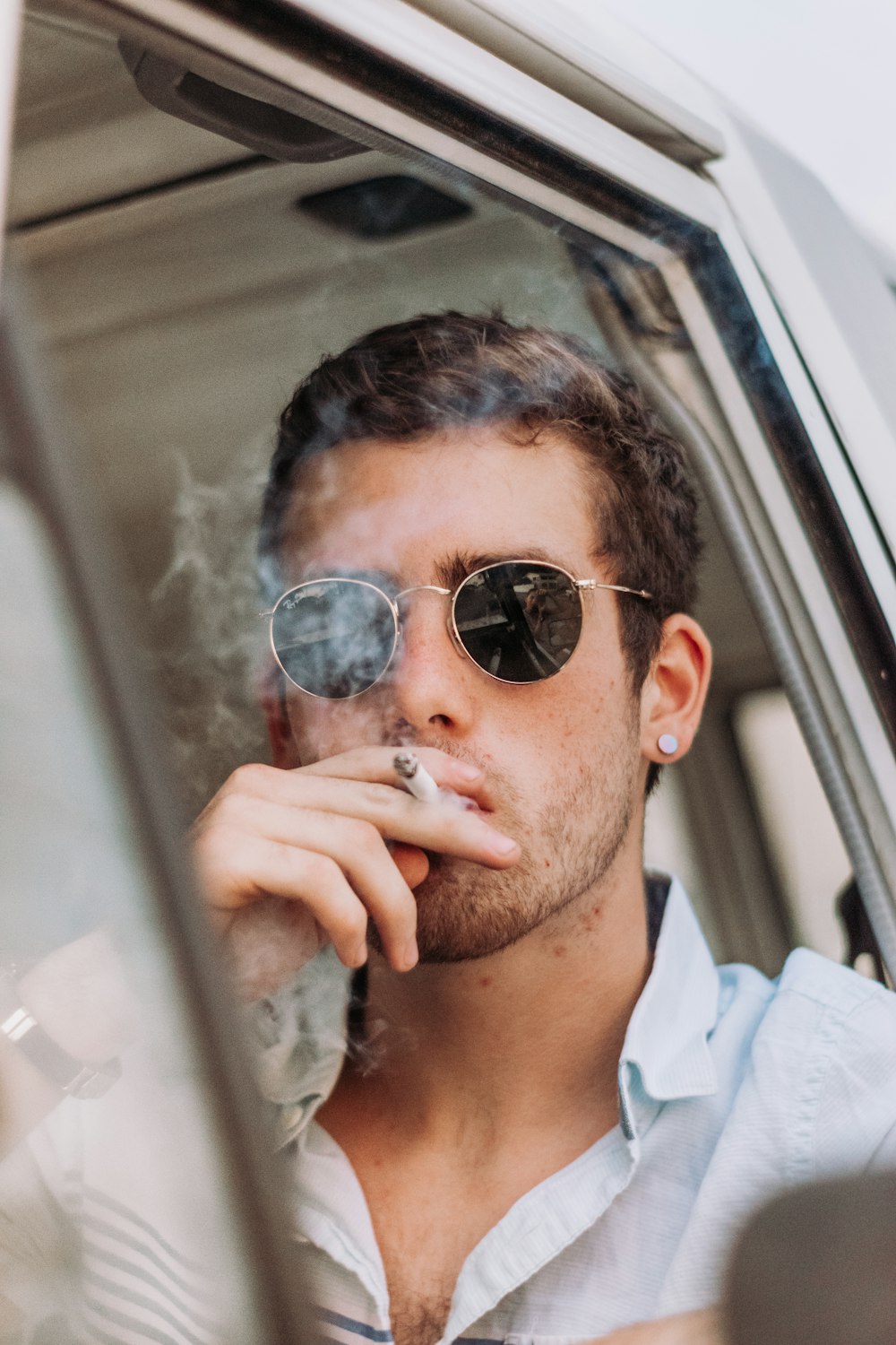 man in white collared shirt wearing black sunglasses