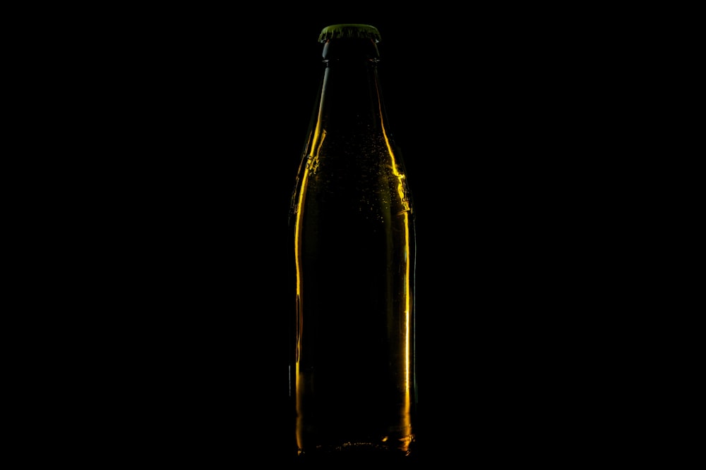 brown glass bottle with white background