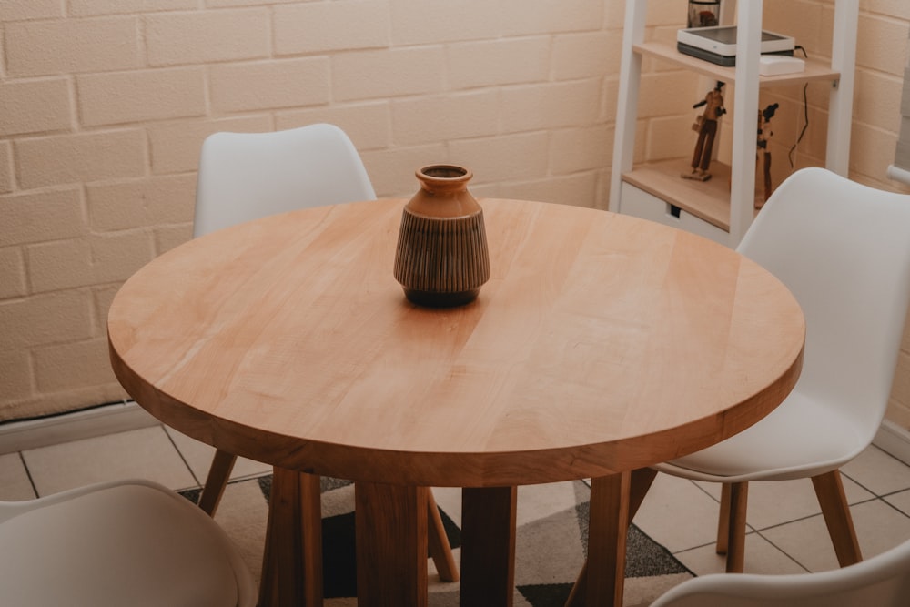 brown ceramic mug on round table
