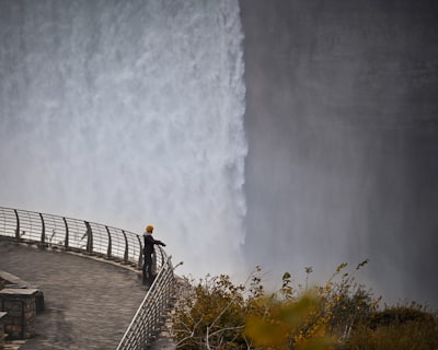 brown wooden fence on gray concrete floor niagara falls teams background