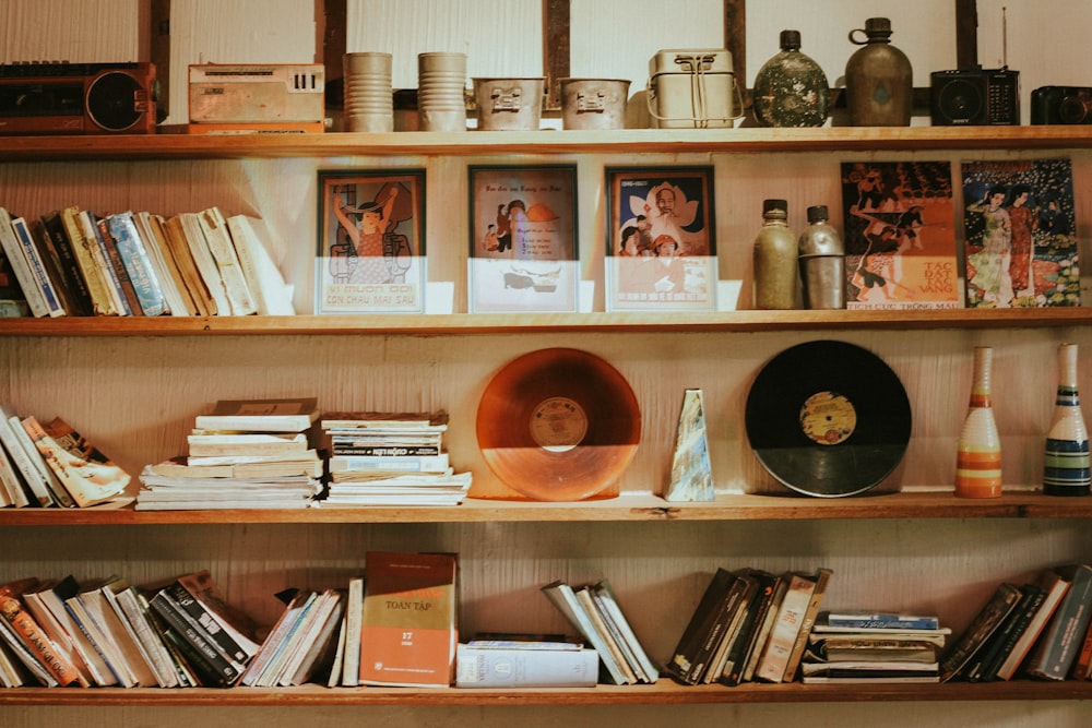 brown wooden shelf with books and bottles