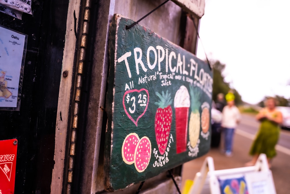 green and white wooden signage