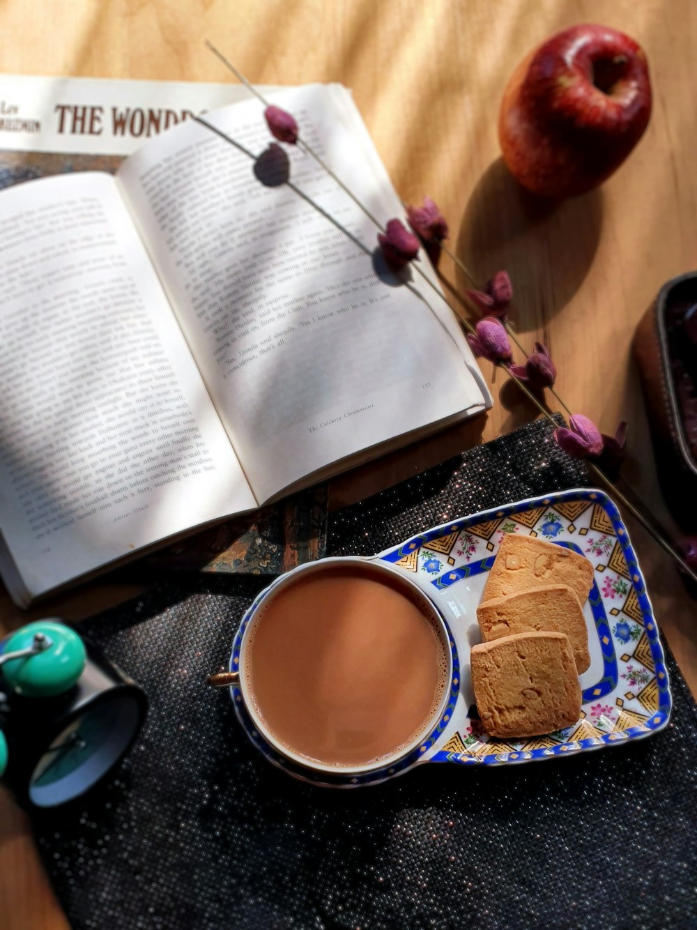 bread on white and blue ceramic plate beside white ceramic mug