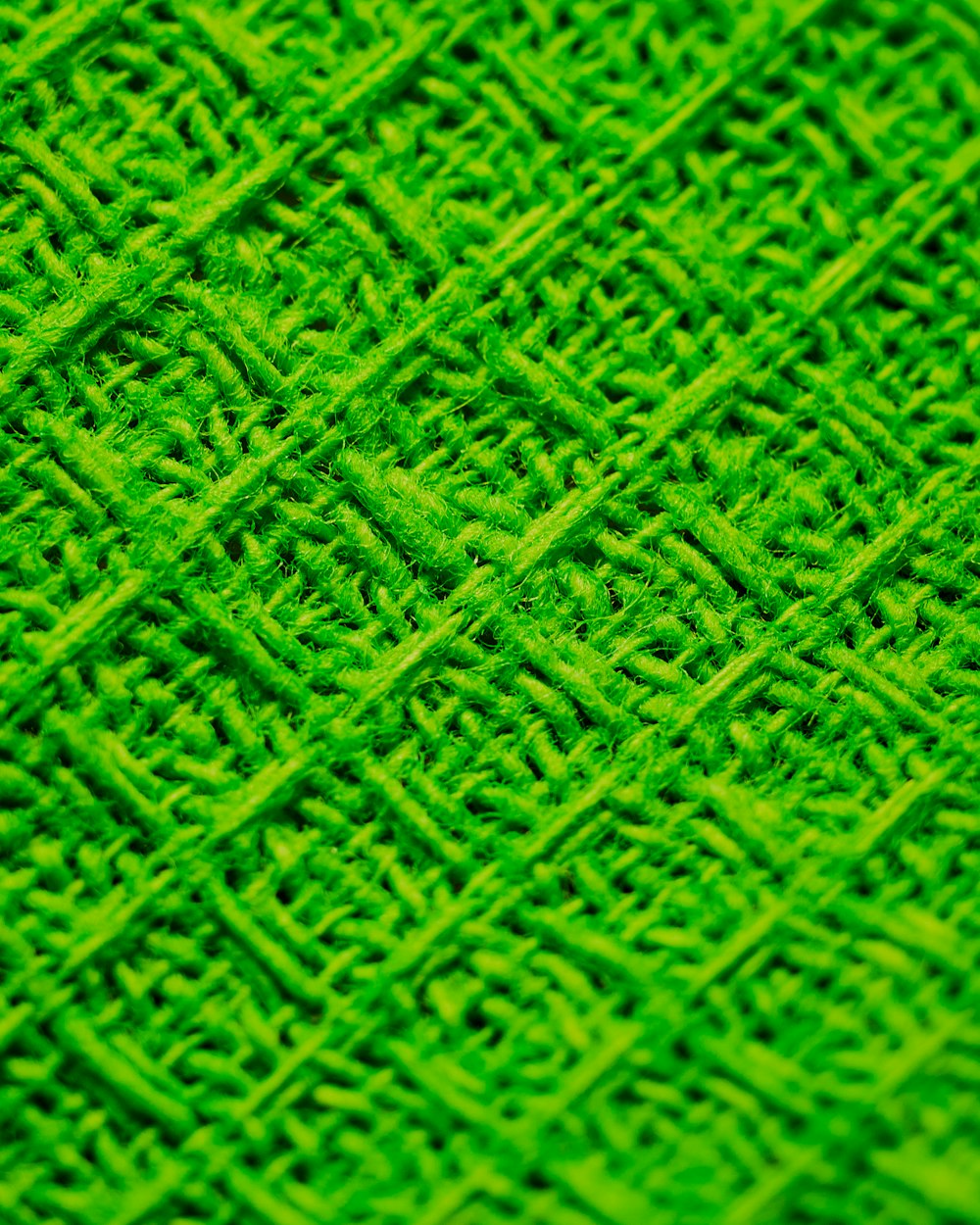 green and black woven textile