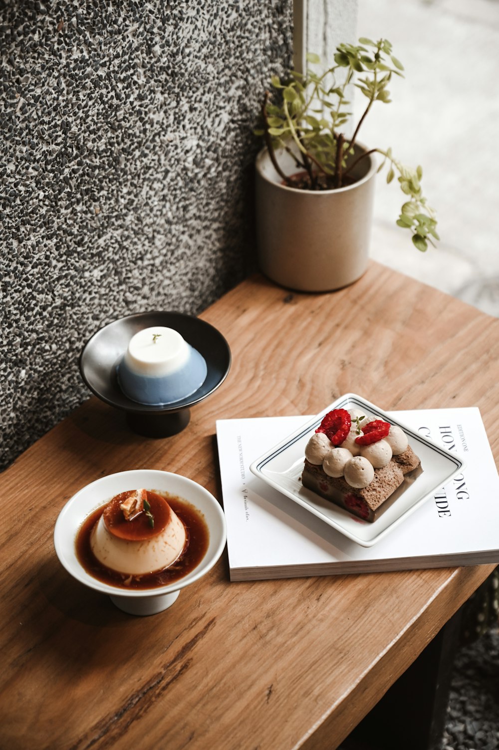 a table with a plate of food and a cup of coffee