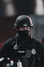 A police officer happily browsing uniform options on a sleek black and red themed online store.