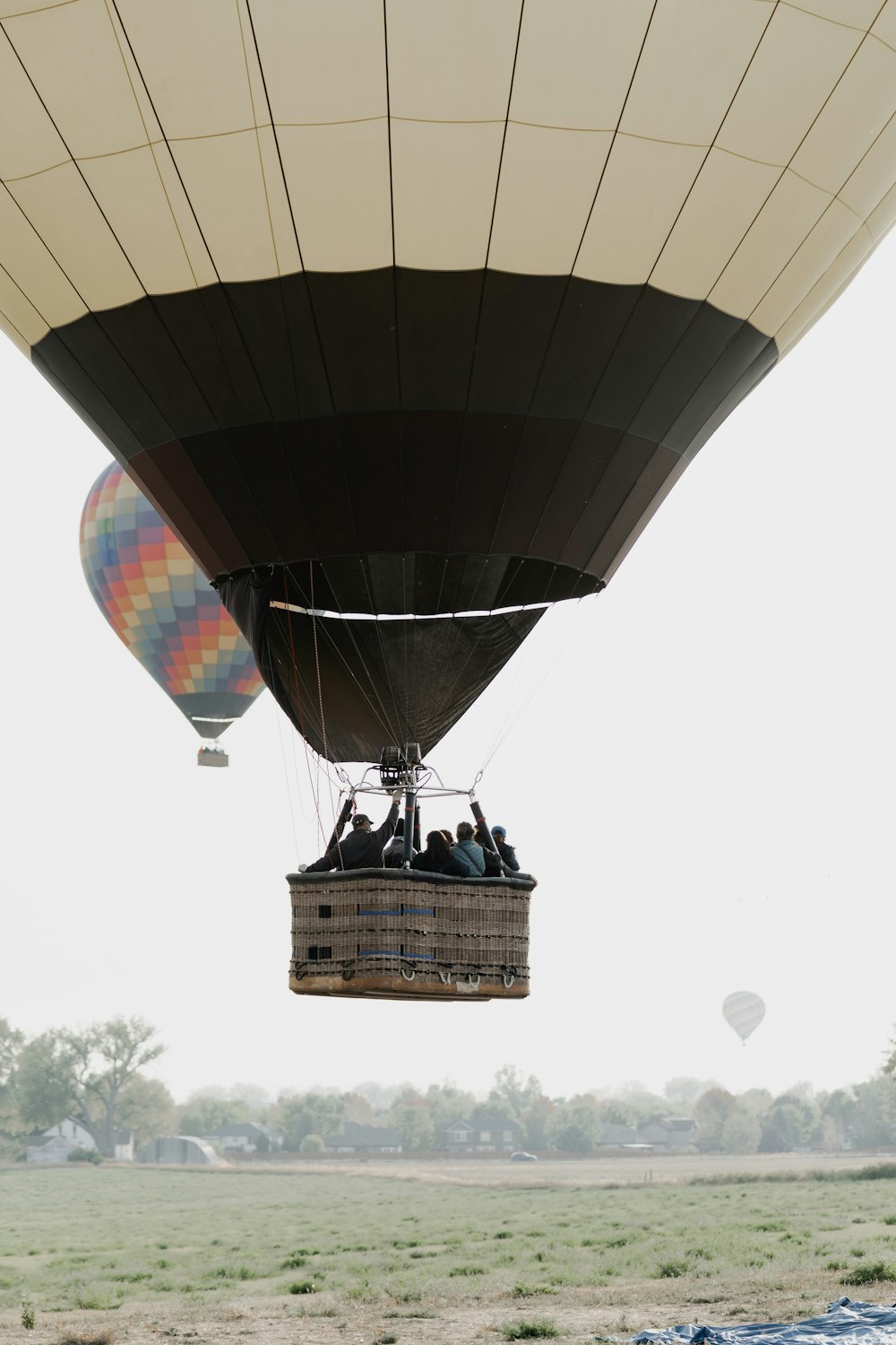 people riding hot air balloon during daytime