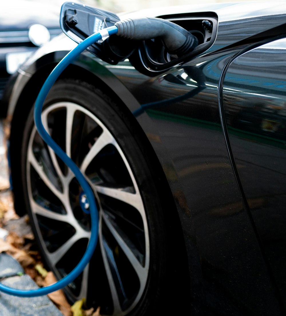 an electric car plugged in to a charger