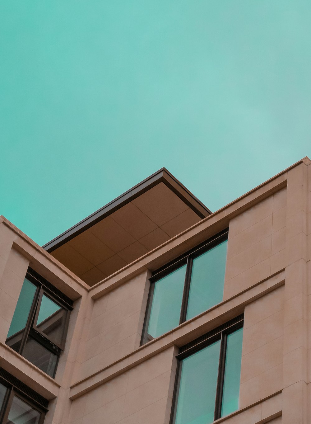 brown concrete building under blue sky during daytime