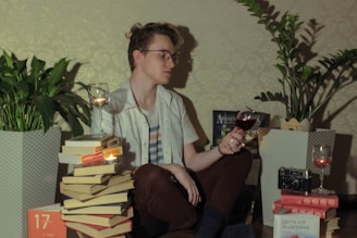 A cozy reading nook with a glass of red wine and an open notebook filled with tasting notes.