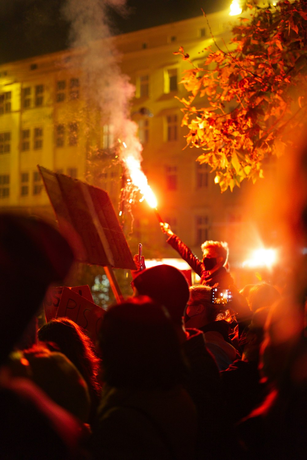 people gathering near building during night time