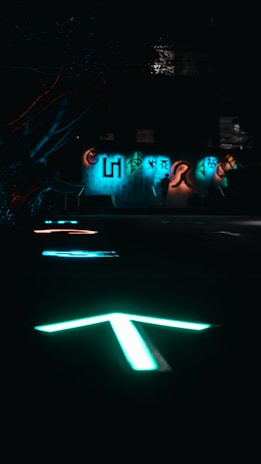 Screenshot of a dark, atmospheric indie game level with glowing neon elements.