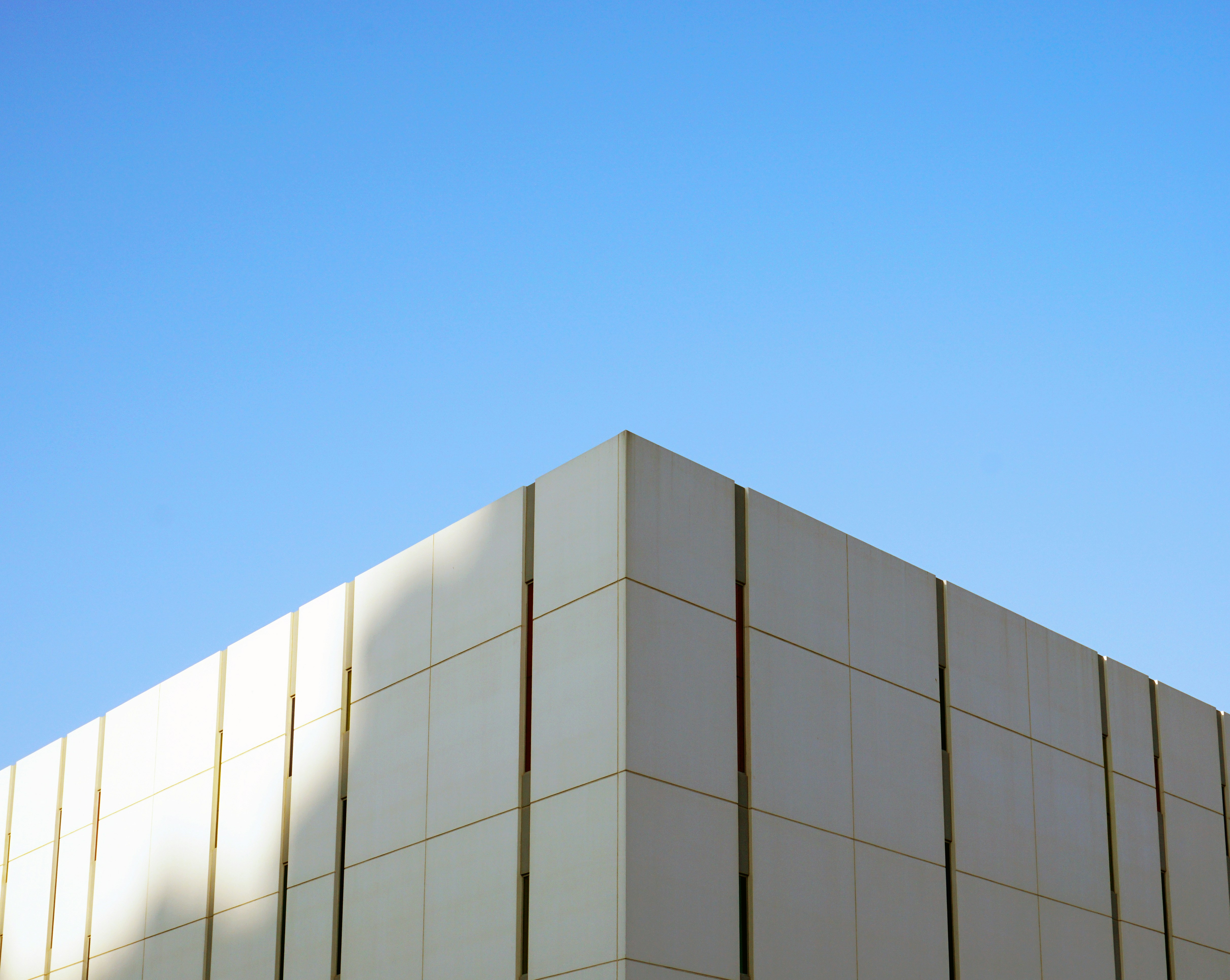white concrete building under blue sky during daytime